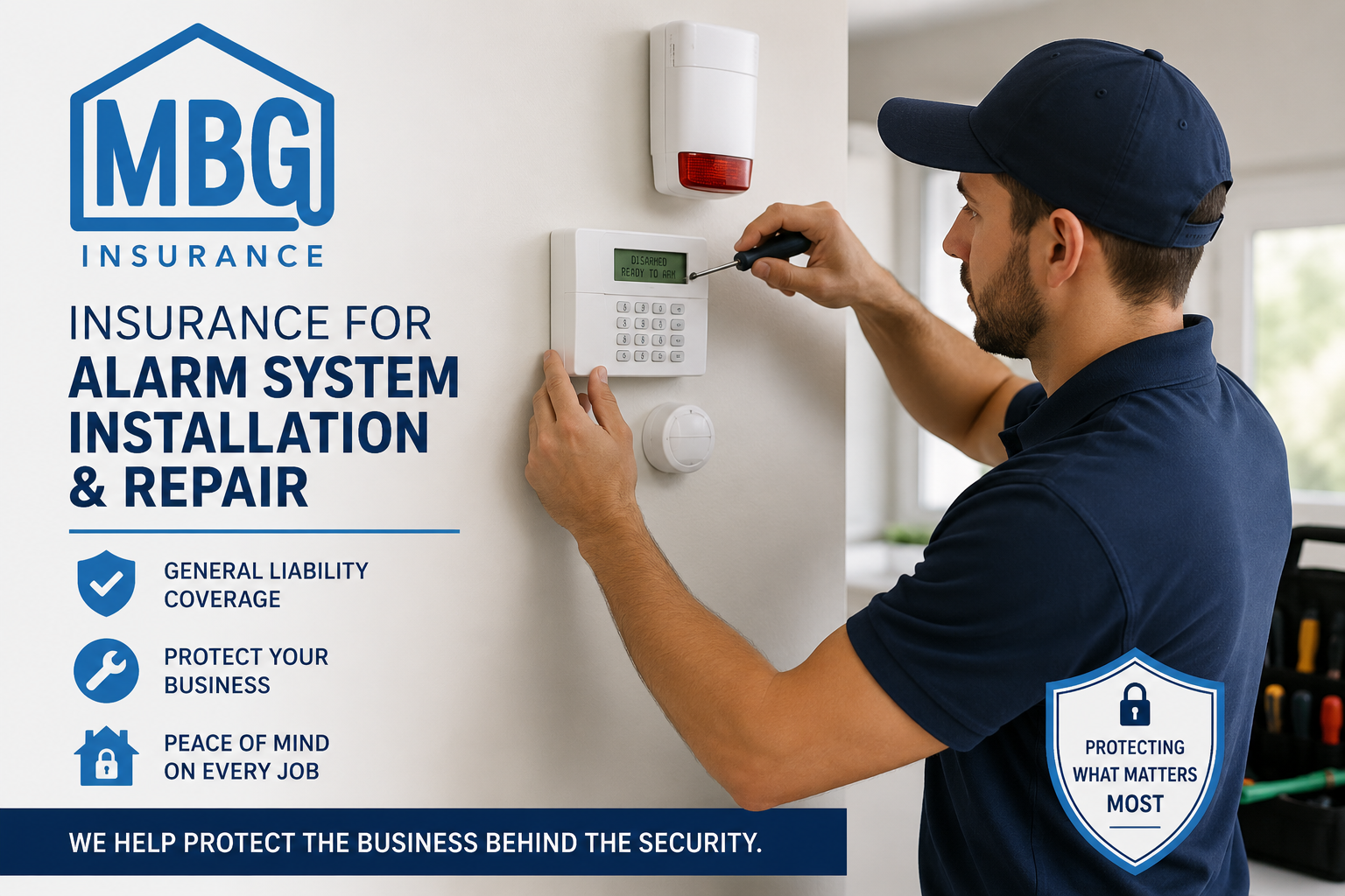 Man installing an alarm system